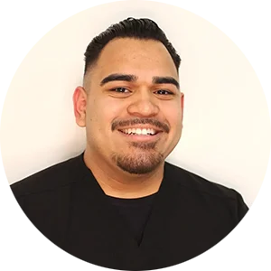 Professional portrait of Eric Corrales, the dedicated Office Manager ensuring a smooth and welcoming patient experience at Harmony Dentalcare